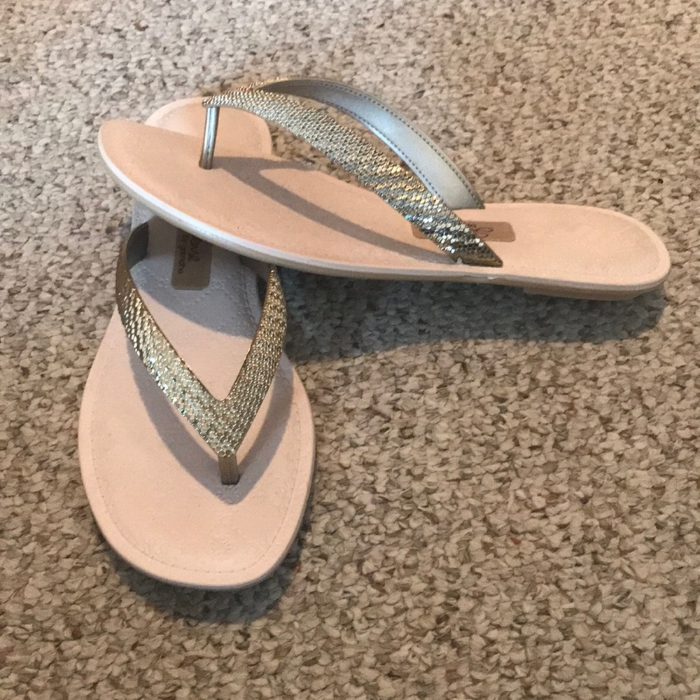 Gold tone flip flops